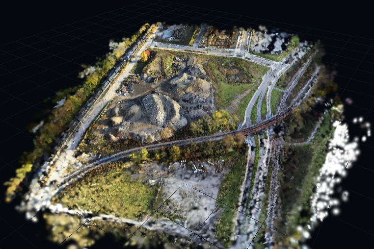 A Gaussian splat of a quarry site seen from above at an angle, the whole site in one frame.
